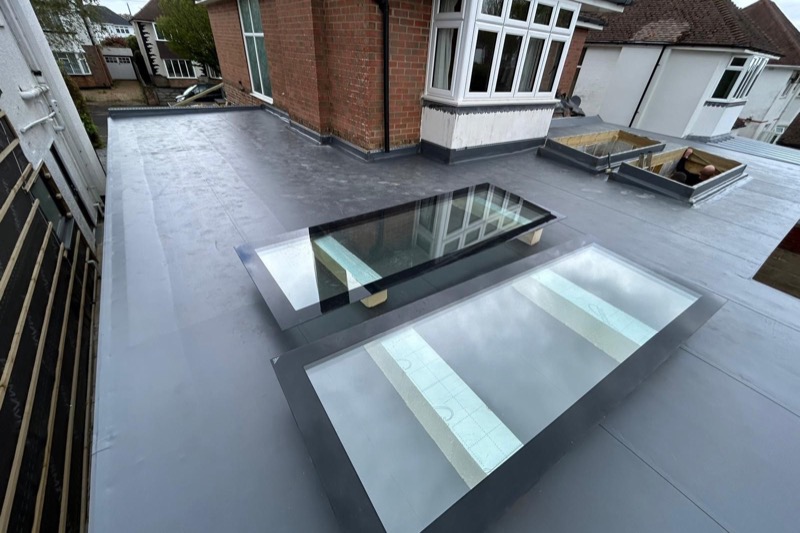 QPH Roofing single ply membrane flat roof with roof lights on residential property in South England